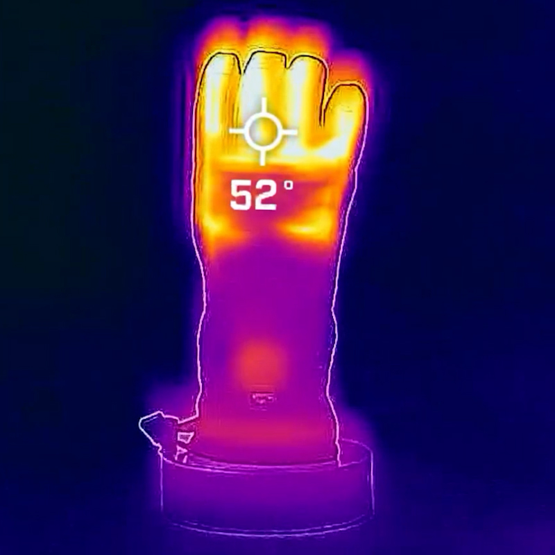 Termisk billede af en handbeholder viser en temperatur på 52 grader, hvilket indikerer varmeudstråling fra varmepåklædningen.